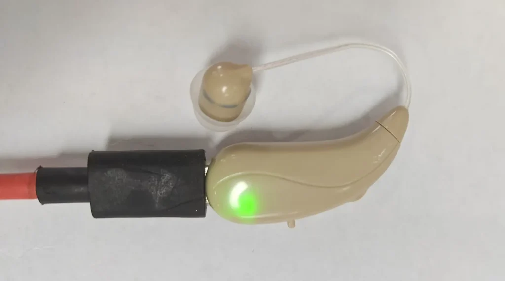 The 702a hearing aid is being charged