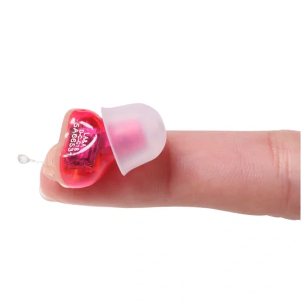 An in-the-ear hearing aid placed on the tip of the finger