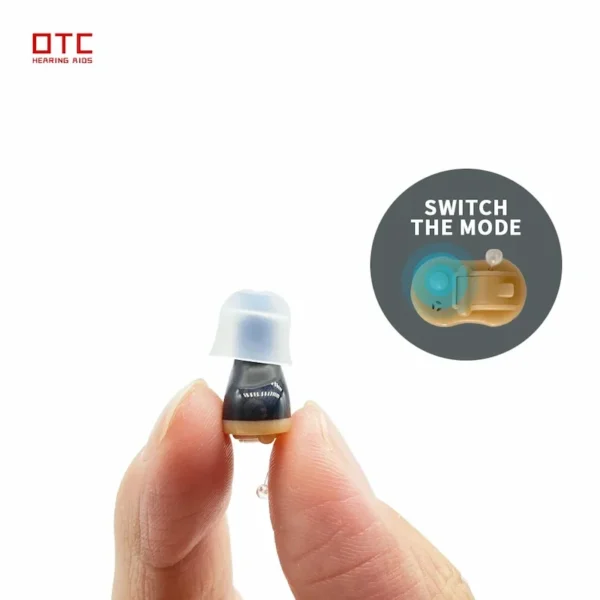 The Q10 hearing aid is held in hand